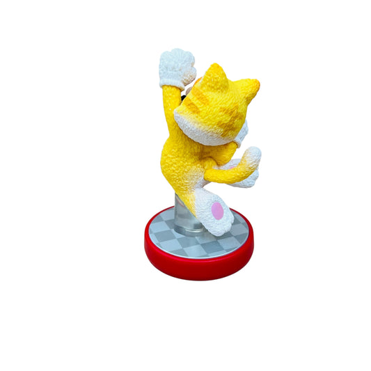 Yellow plush toy with a red base on a white background