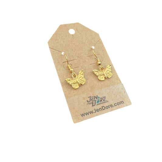 Gold butterfly earrings on a Jen Dore branded card against a white background