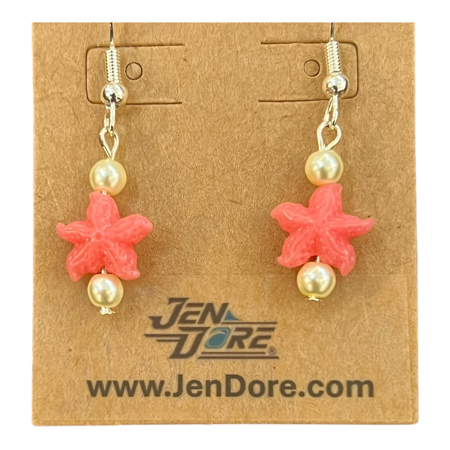 Starfish-shaped earrings with pearls on a JenDore branded card.