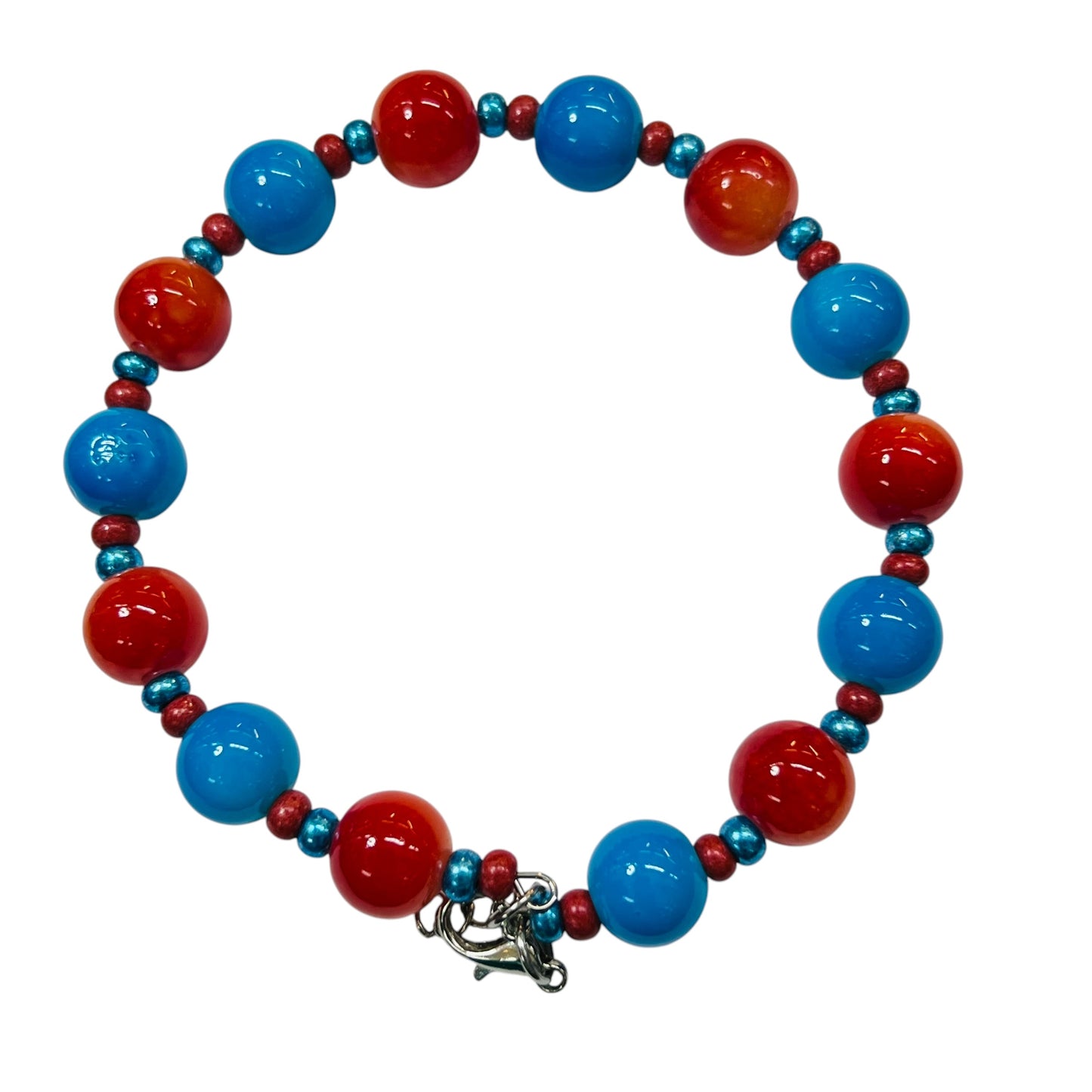 A beaded bracelet featuring alternating large glossy blue and red beads, with smaller metallic blue and red spacer beads, and a silver-toned clasp, shown on a plain white background.