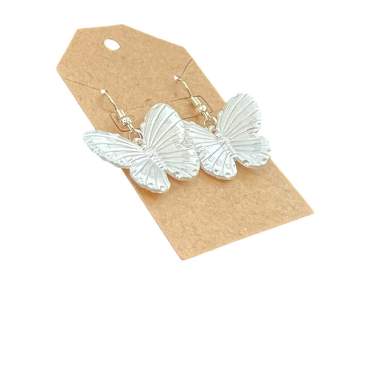 JenDore Butterfly-shaped earrings on a brown paper tag against a white background