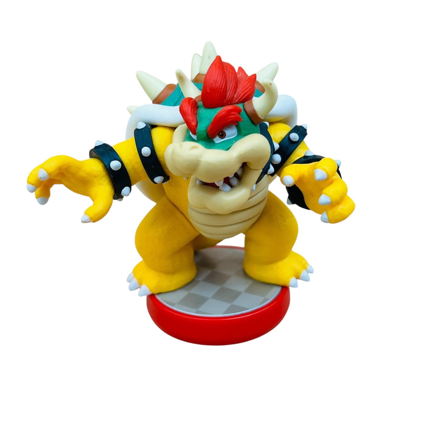 Toy figure of a character with yellow body, red hat, and white spikes on a white background