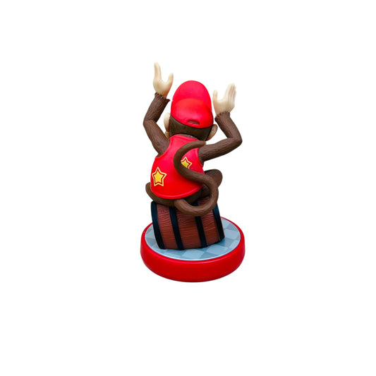 Figurine of a character in a red outfit with a star on a white background
