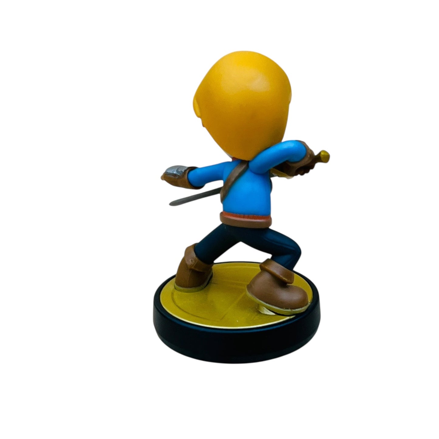 Figurine with a yellow head and blue outfit on a white background