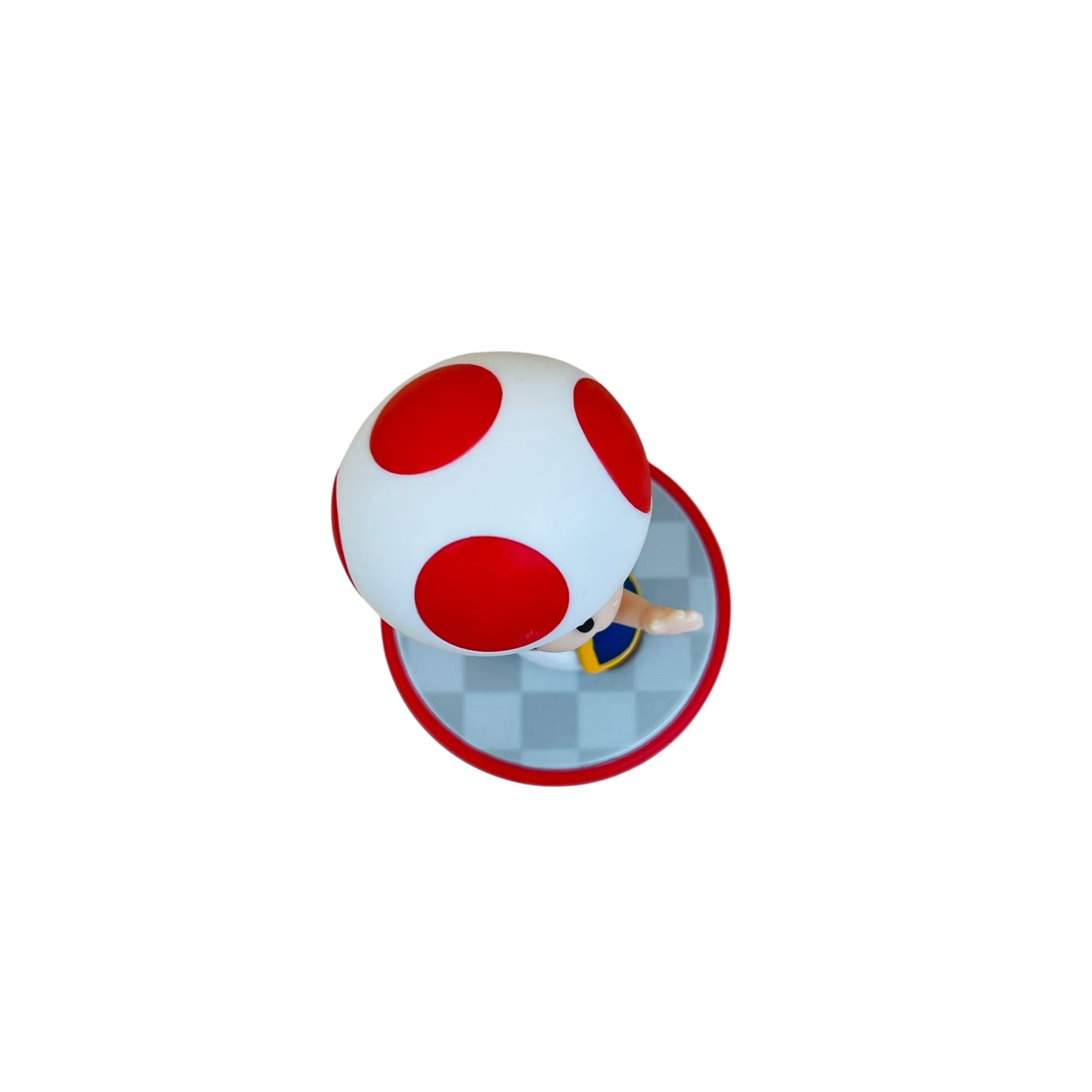 Red and white mushroom character from a video game on a white background