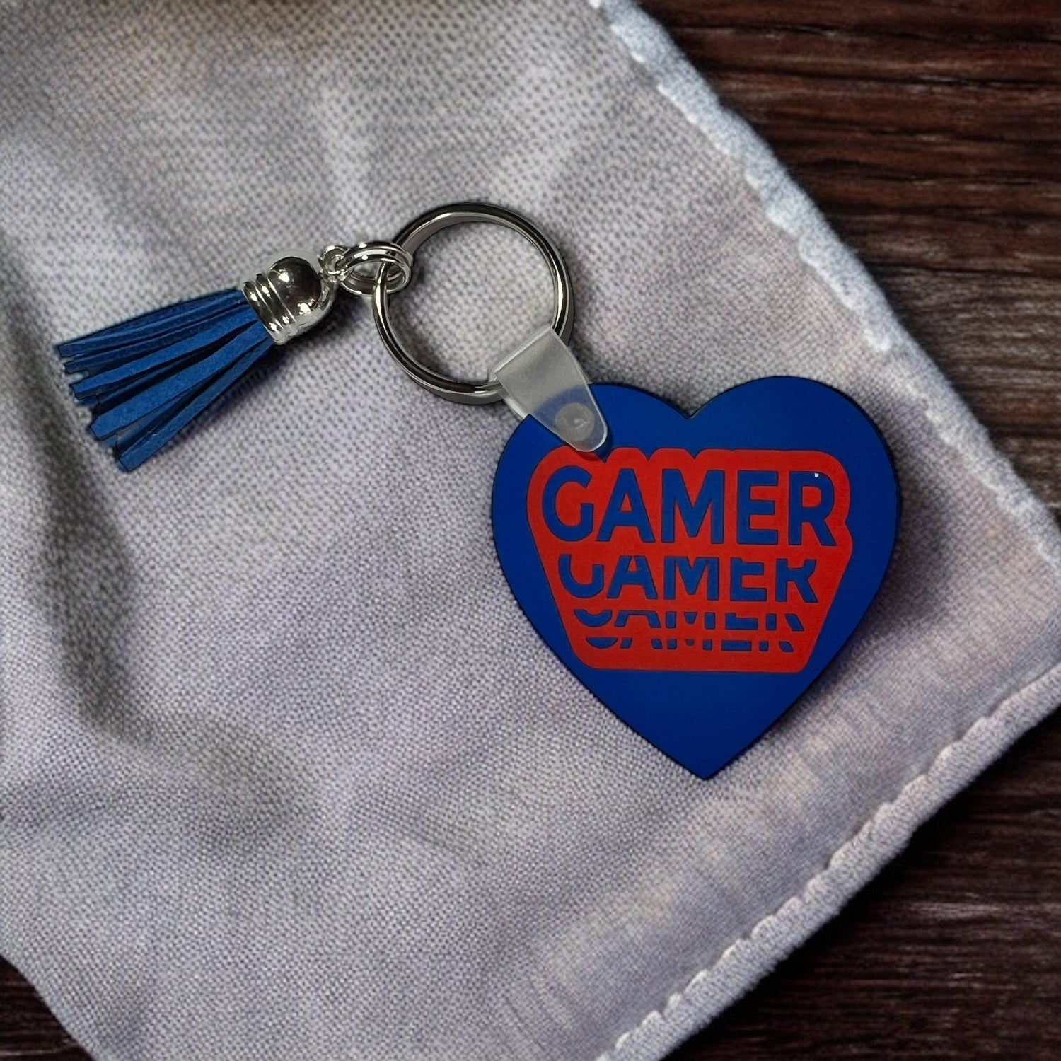 Blue Red Gamer Keychain on white cloth