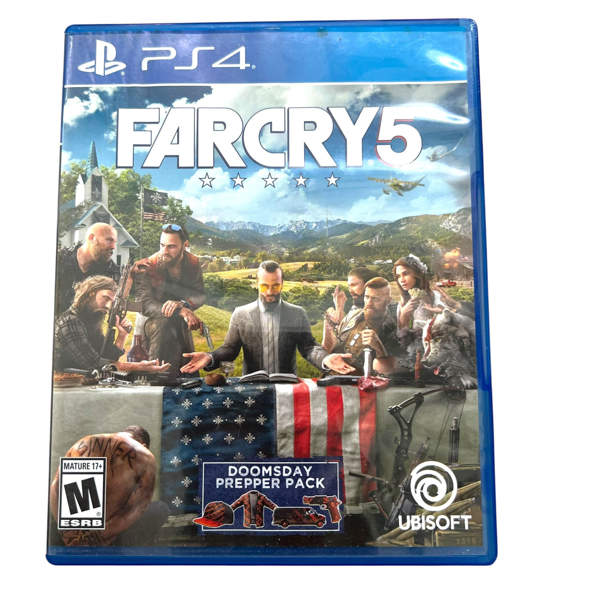 A physical copy of the PlayStation 4 game Far Cry 5, featuring the 'Downday Prepper Pack' DLC on the left side of the cover. The game case is photographed on a clean white background.