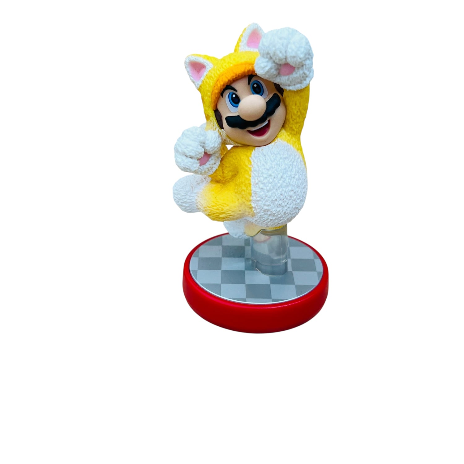 Toy figure of a character in a yellow outfit with a checkered base on a white background