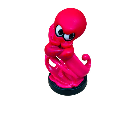 Pink octopus figurine on a white background
