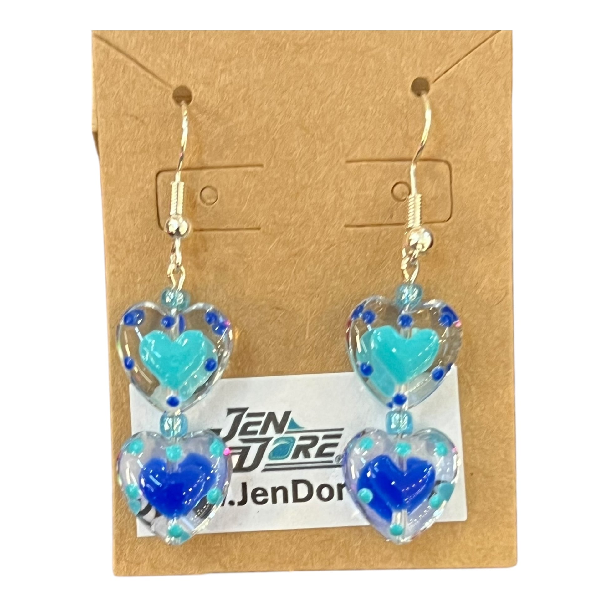 Heart-shaped earrings with blue and turquoise colors on a display card with JenDore branding.