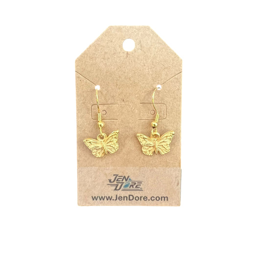 Gold butterfly earrings on a Jen Dore branded card against a white background