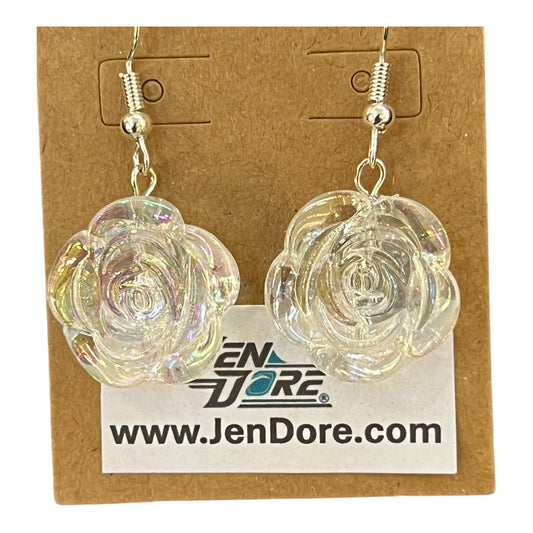 Clear rose-shaped earrings on a JenDore branded card.