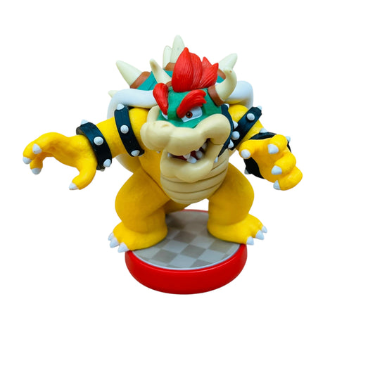 Toy figure of a character with yellow body, red hat, and white spikes on a white background