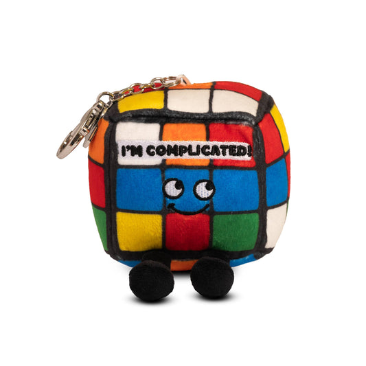 Colorful plush keychain designed like a Rubik's Cube with a face and text 'I'm Complicated!' on a white background.