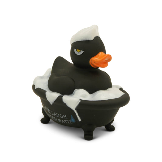 Black rubber duck in a bathtub with foam, on a white background