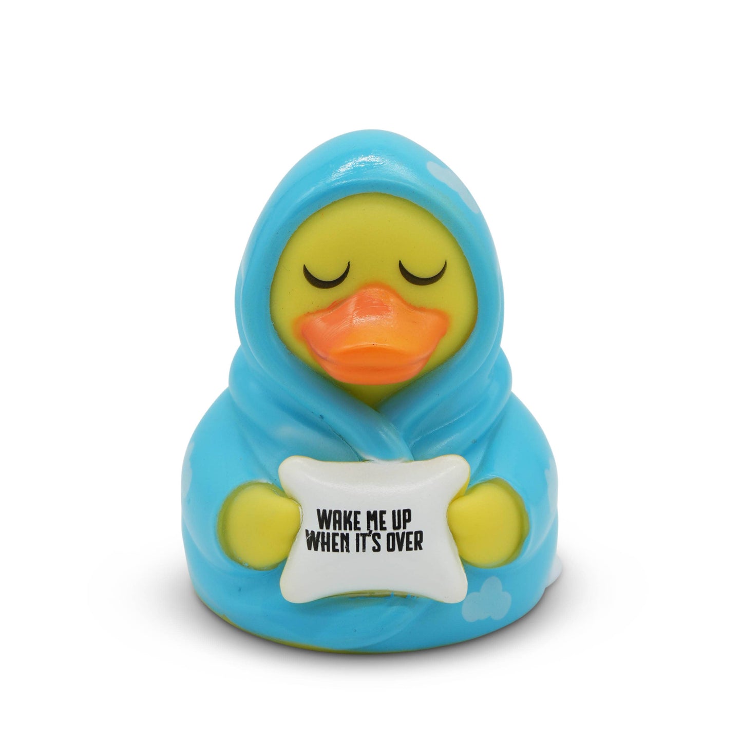 Toy duck wrapped in blue blanket with 'Wake Me Up When It's Over' sign on white background