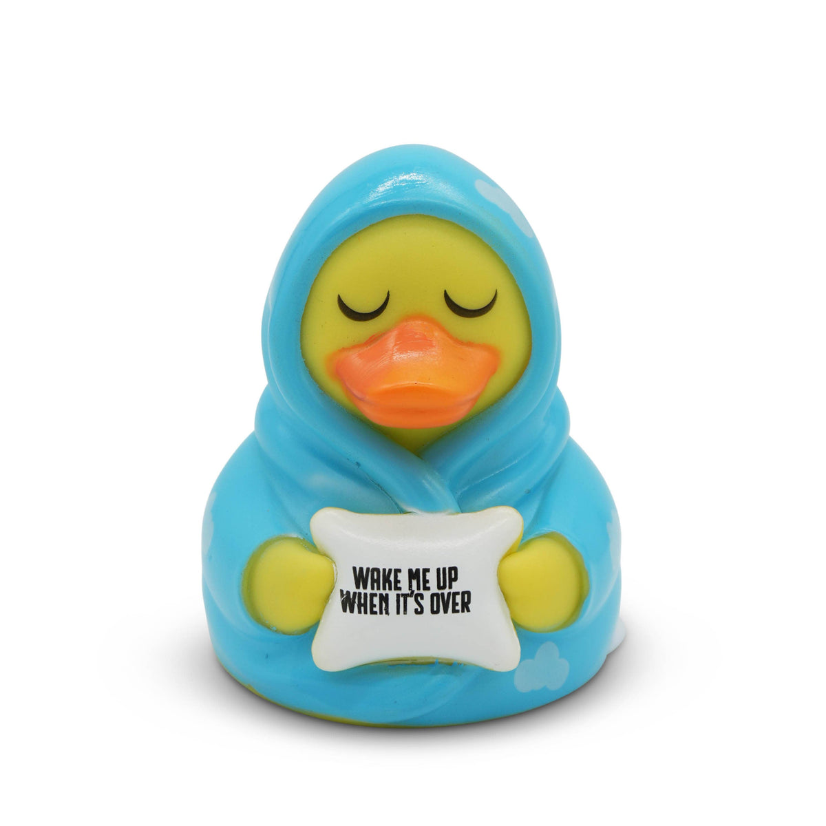 Toy duck wrapped in blue blanket with 'Wake Me Up When It's Over' sign on white background