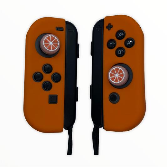 Jendore Poignées de pouce orange et coque de protection en silicone pour Nintendo Switch Joy-con